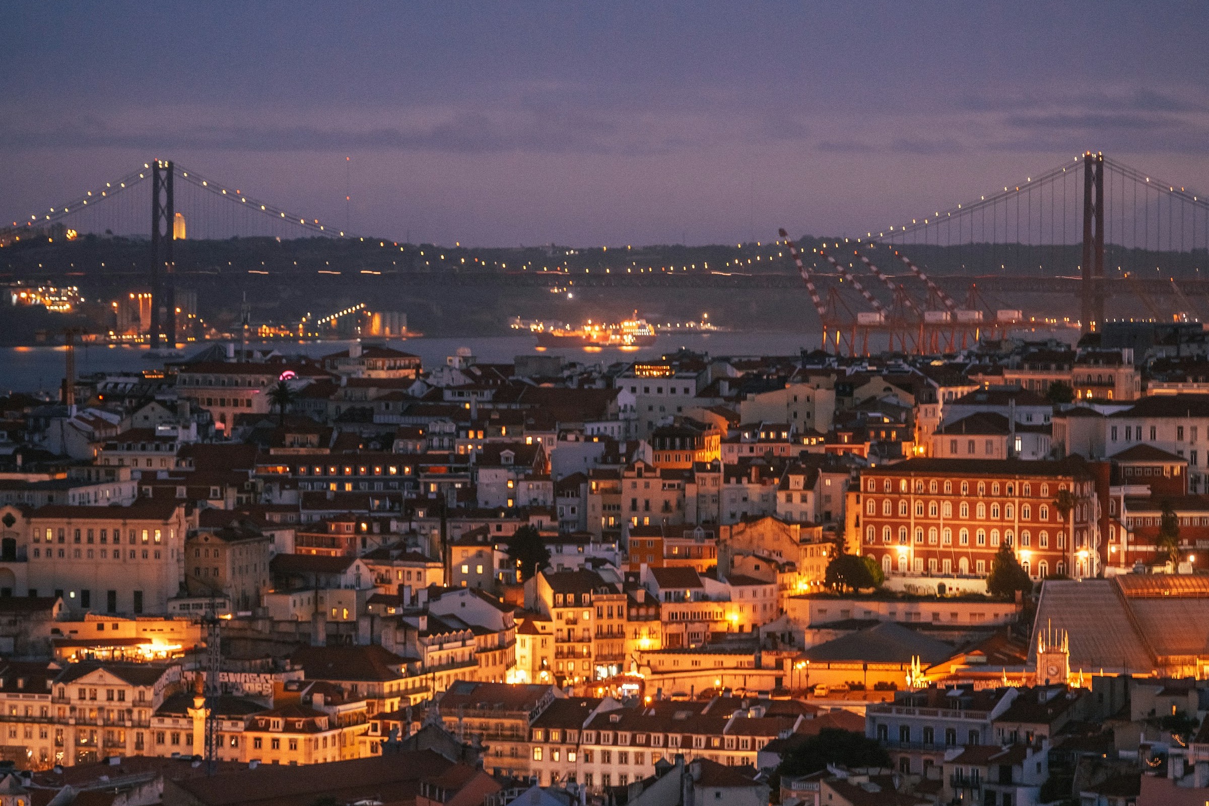 Lisbon skyline and the Tagus River at dusk, Portugal.